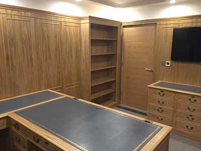 Traditional wood panelling in home study.