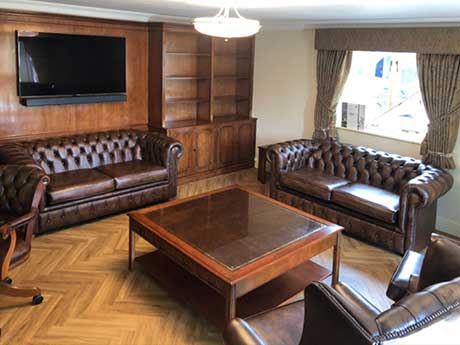 Traditional home study with bookcases and panelling
